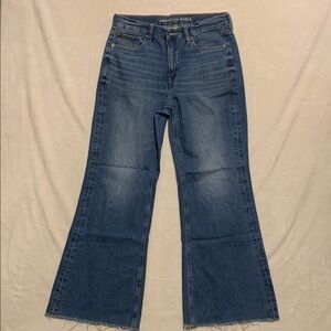 American Eagle Low Rise Baggy flare Jeans Women's  8 Short  Denim raw hem flaw